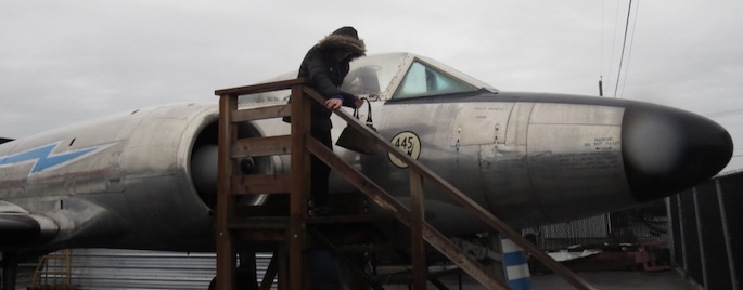 Outside in the rain, Ellen Ratzlaff looked over a CF-100 fighter jet from the 50's and 60's.