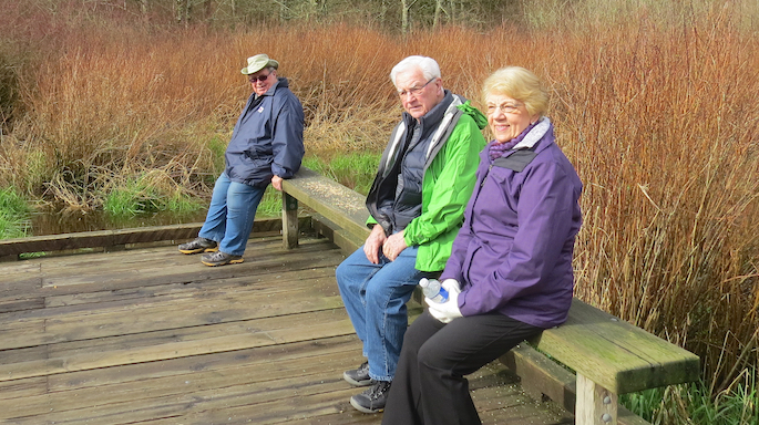 Ted McKinnon, along with Ernie and Barb Winkelmann, took a load off while relaxing on the platform. 