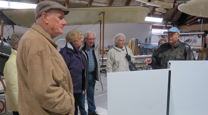 Phil, along with Velma Derksen, Barb and Ernie Winkelmann,Mary Neufeld, and Ellen Ratzlaff listened intently as their tour guide explained one of the displays.
